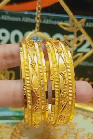Elegant Gold Bangle Pair with Intricate Detailing